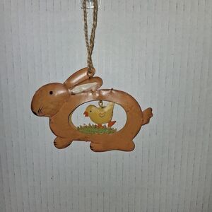 Easter Decoration Rabbit With Dangling Chick Running Through Grass